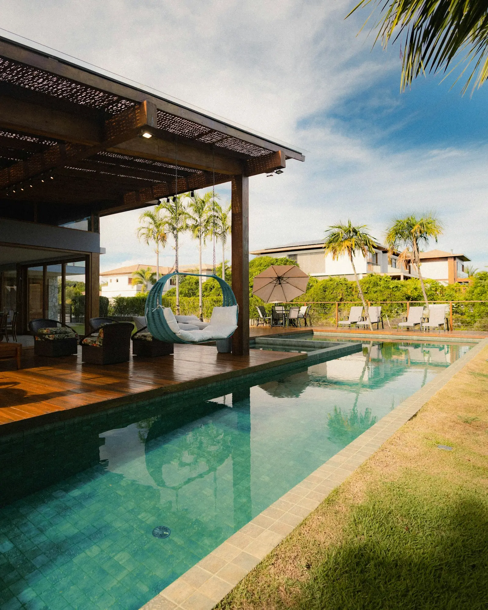 Reference: residential pool with wooden deck and tile coping